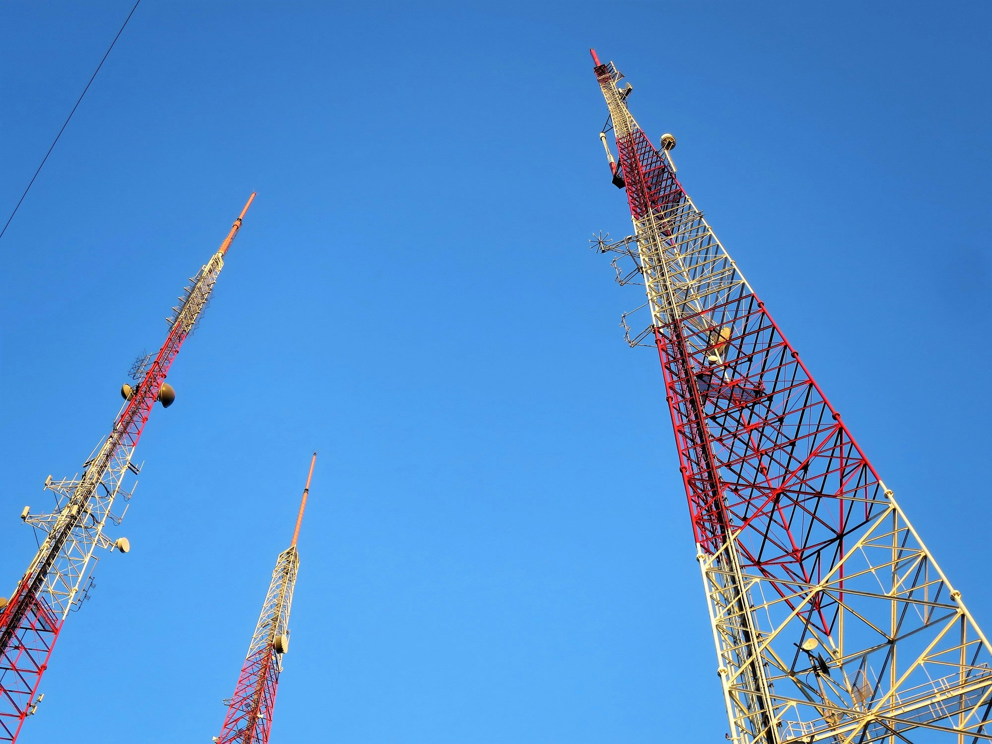 Three Cell Towers During the Day